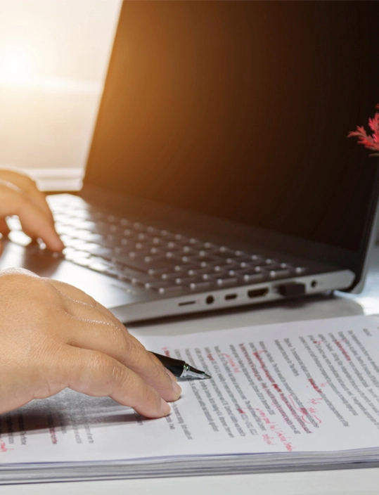 Overlay image of edited documents and notes for editorial services