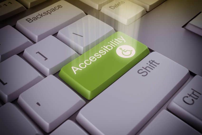 Laptop with accessibility icons like keyboard navigation and screen reader