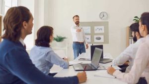 Presenter showcasing a business pitch deck to an audience