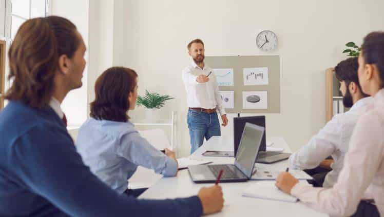 Presenter showcasing a business pitch deck to an audience