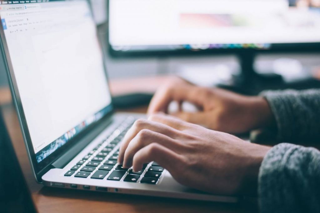 Magnifying glass over content layout with SEO icons
