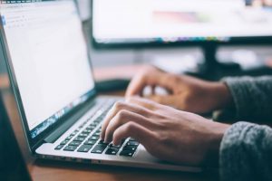 Magnifying glass over content layout with SEO icons