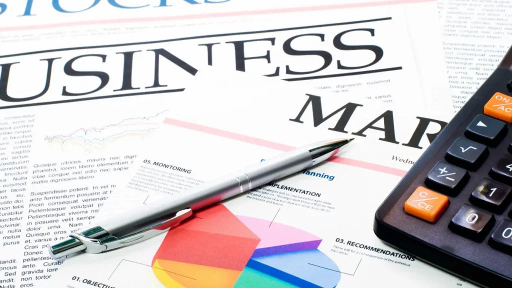 Business report draft with handwritten notes and edits