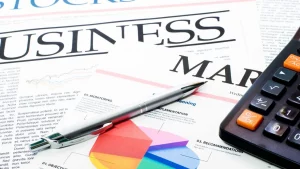 Business report draft with handwritten notes and edits