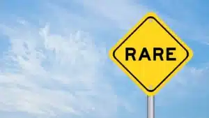 Yellow ‘RARE’ sign reflecting authentic storytelling over perfection.
