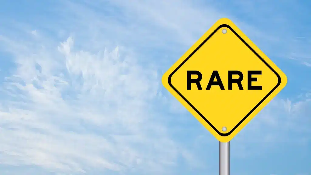 Yellow ‘RARE’ sign reflecting authentic storytelling over perfection.