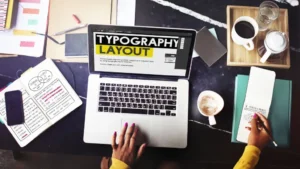 Designer working on future typography layout with variable fonts and kinetic text.