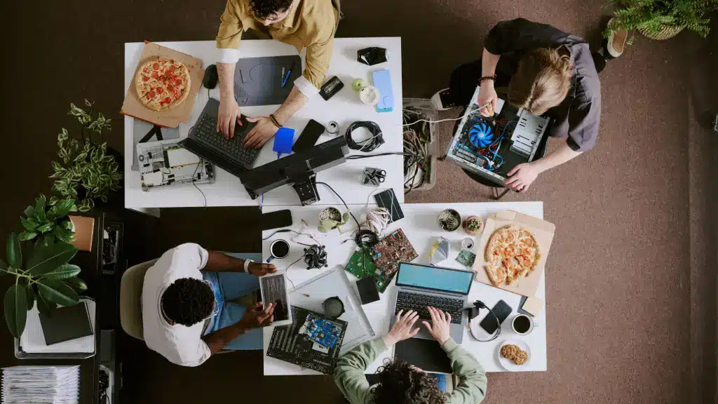 Team brainstorming ideas for repurposing content across multiple digital platforms.