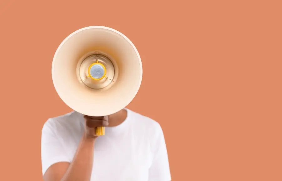 Person holding a megaphone symbolizing how brands use micro-storytelling to capture attention on social media