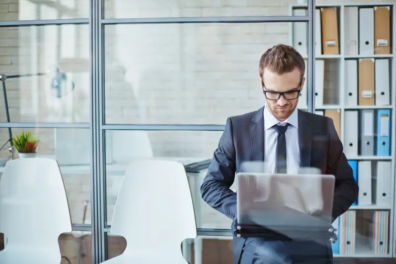 Professional reviewing reports to support trust and credibility in business communication