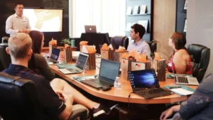 business leaders reviewing a corporate presentation during a meeting