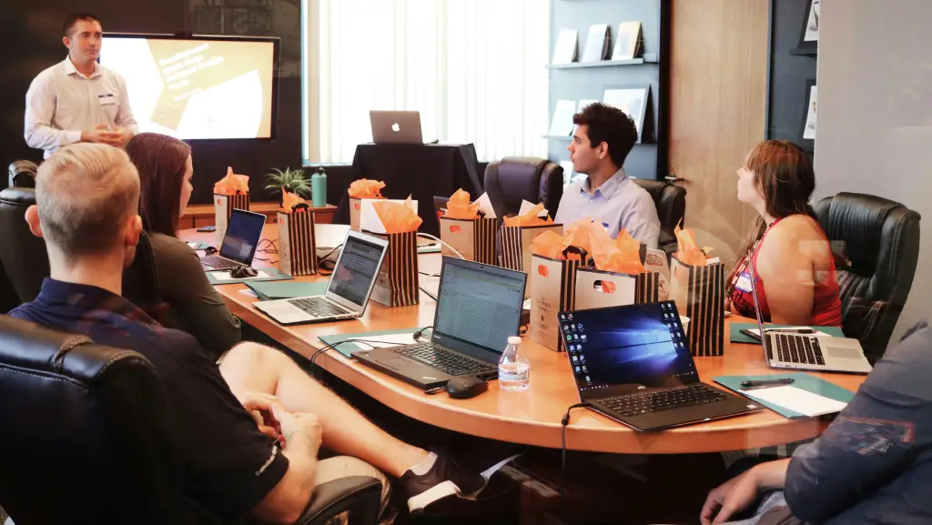 business leaders reviewing a corporate presentation during a meeting