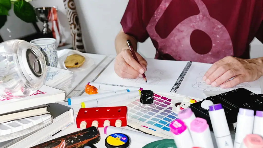 Designer working on hand-drawn concepts, illustrating outsourcing creative services for enterprise design needs.