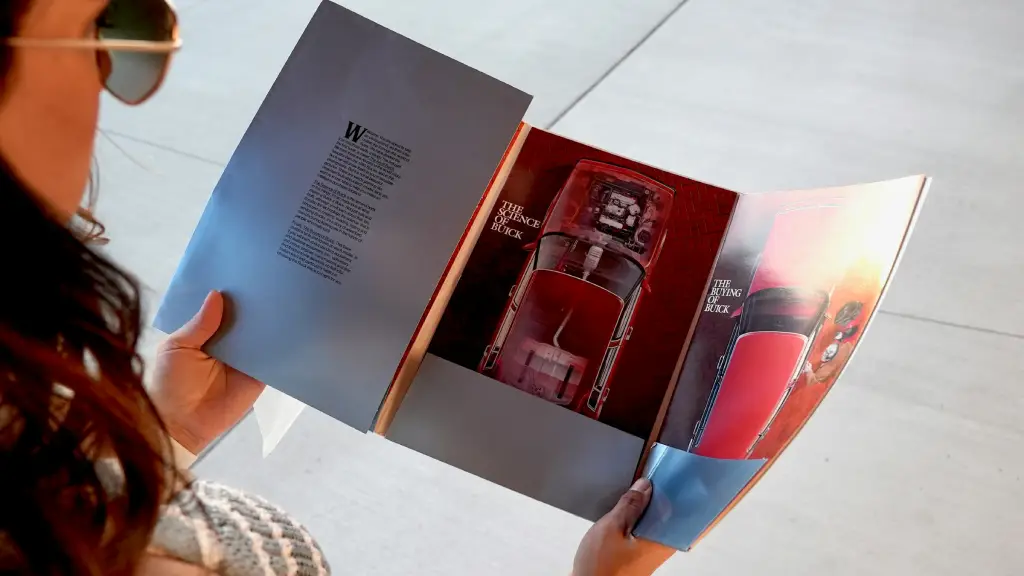 Close-up of a professionally designed brochure with automotive visuals that align with 2026 design trends