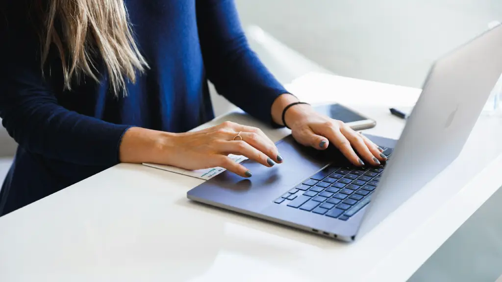 Professional editor reviewing and editing manuscript content on laptop