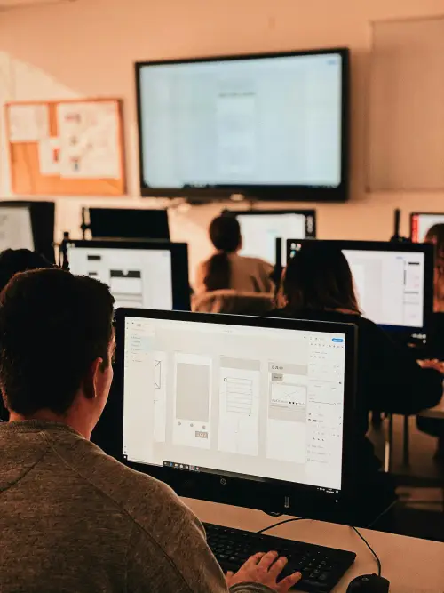 Team of equity analysts collaborating with AI-assisted research tools.