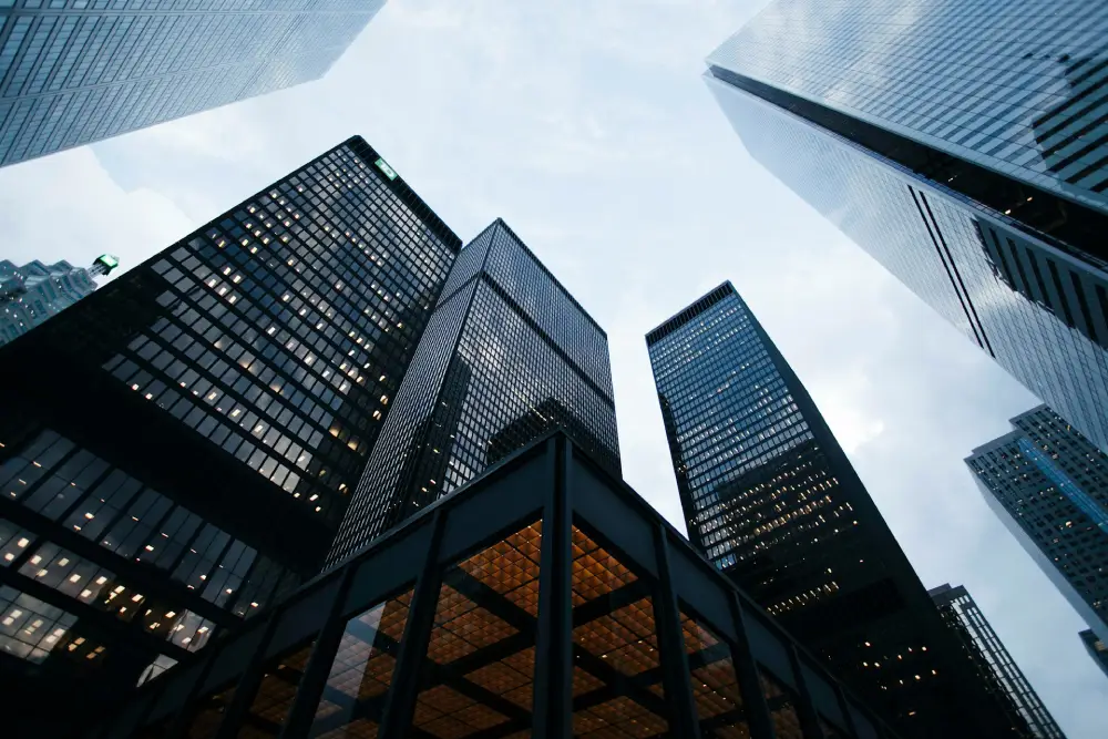 Corporate skyscrapers reflecting the institutional scale investment banking pitch decks must project