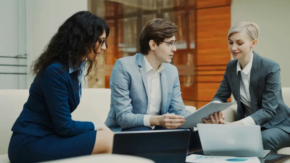 Experts analyzing research notes during a fintech content strategy meeting