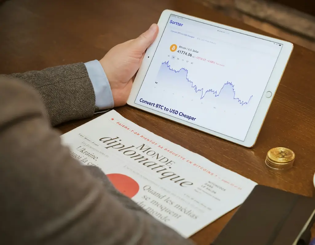 Financial professional analyzing market data on a tablet, relevant to financial translation services