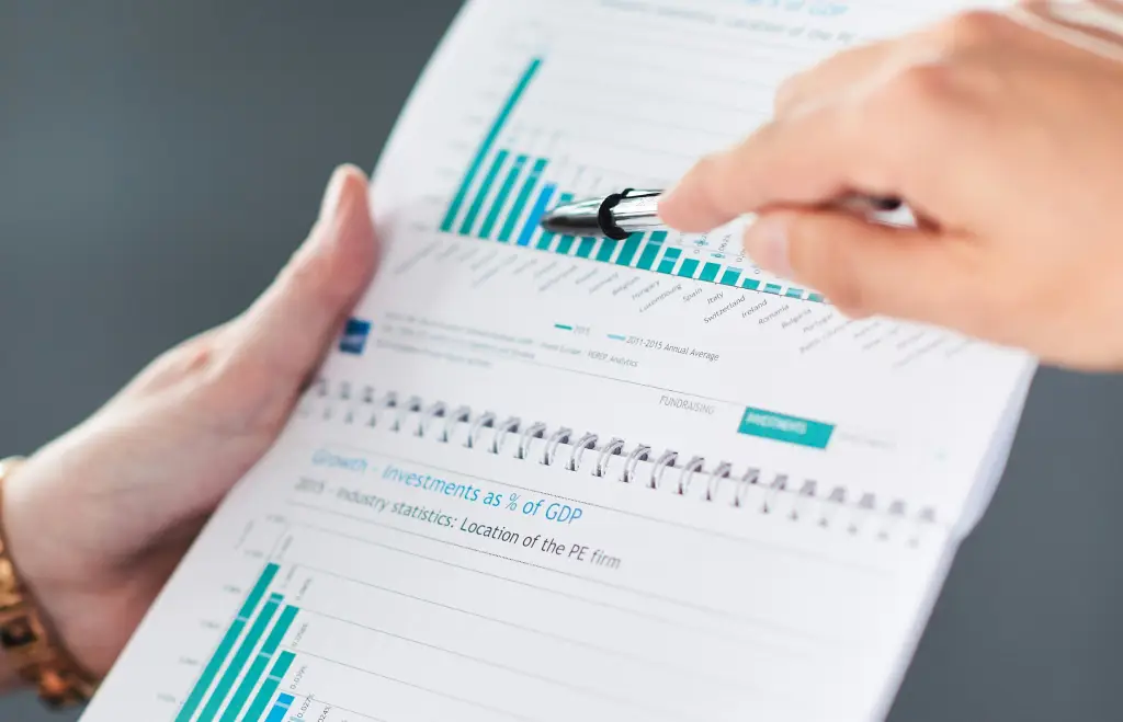 Investor reviewing ESG report data and performance charts